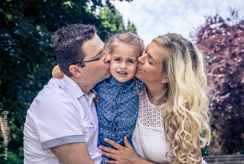 happy family:   mother, father and daughter © Irina