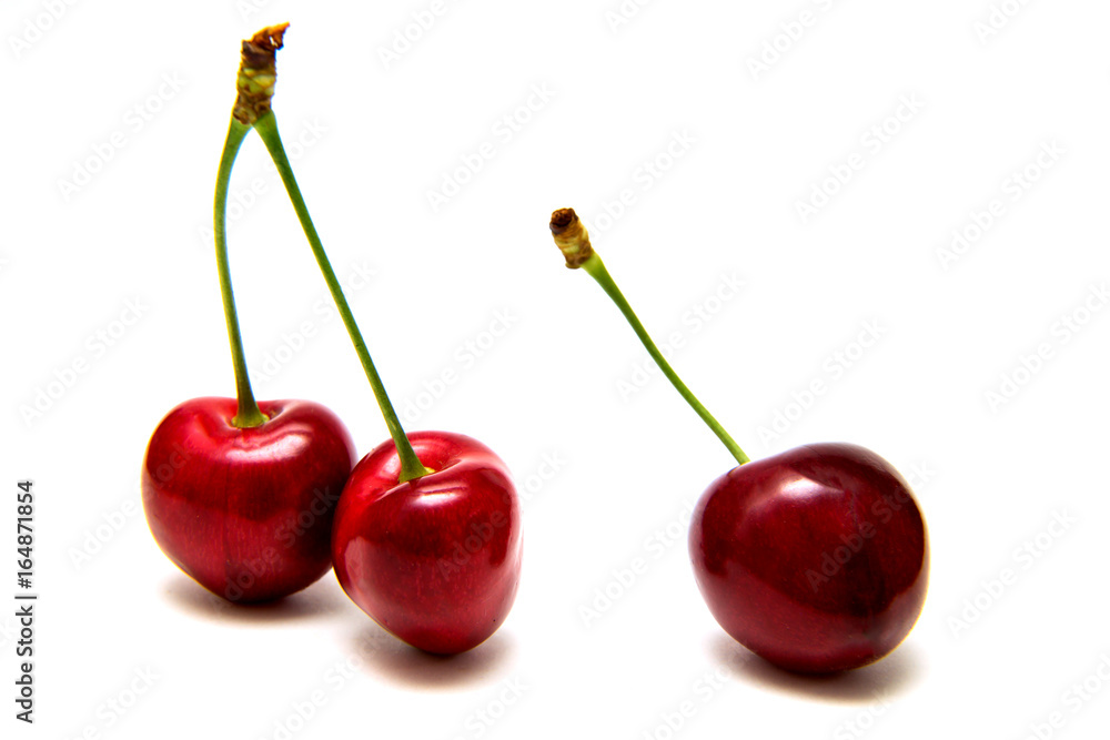 Heart shaped cherry berries isolated on white background cutout Heart shaped cherry berries isolated on white background cutout