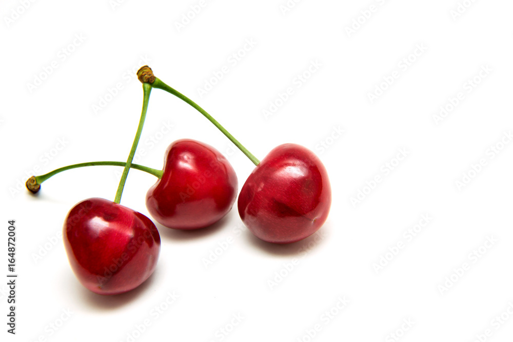 Heart shaped cherry berries isolated on white background cutout Heart shaped cherry berries isolated on white background cutout
