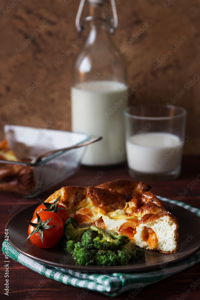 Baked omelet with tomatoes, broccoli and milk bottle Baked omelet with tomatoes, broccoli and milk bottle