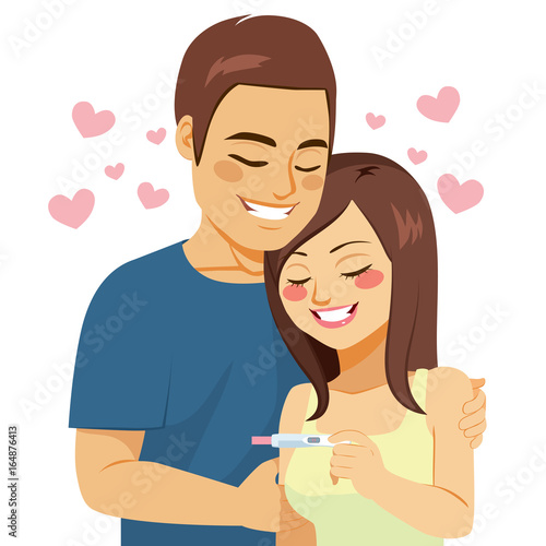 Beautiful young couple happy with positive pregnancy test result