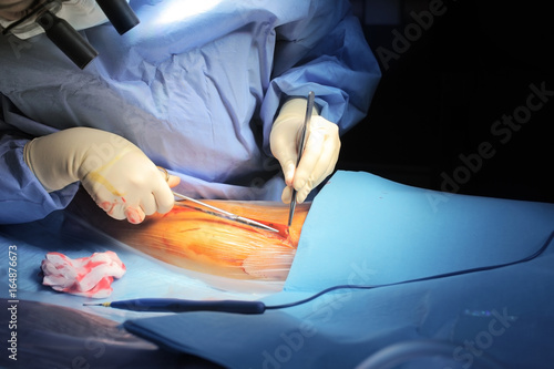 Surgeon cuts the patient's skin during procedure