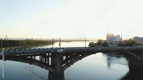 Wallpaper Mural Landscapes with green park, river and houses are shown top closeup. cars and trucks drive on the bridge Torontodigital.ca