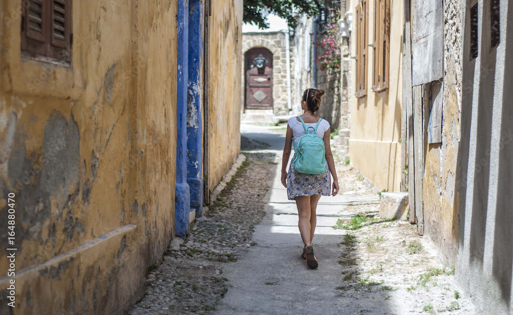 woman in narrow street