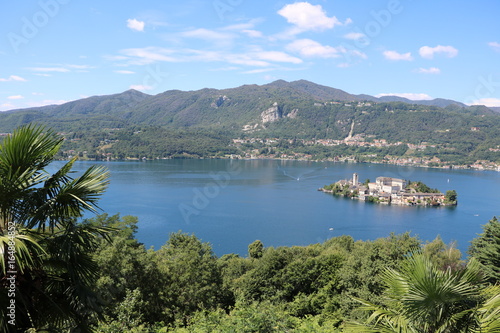 Fototapeta Naklejka Na Ścianę i Meble -  Viewpoint from Sacro Monte d'Orta to Lake Orta and Isola San Giulio in summer, Piedmont Italy 