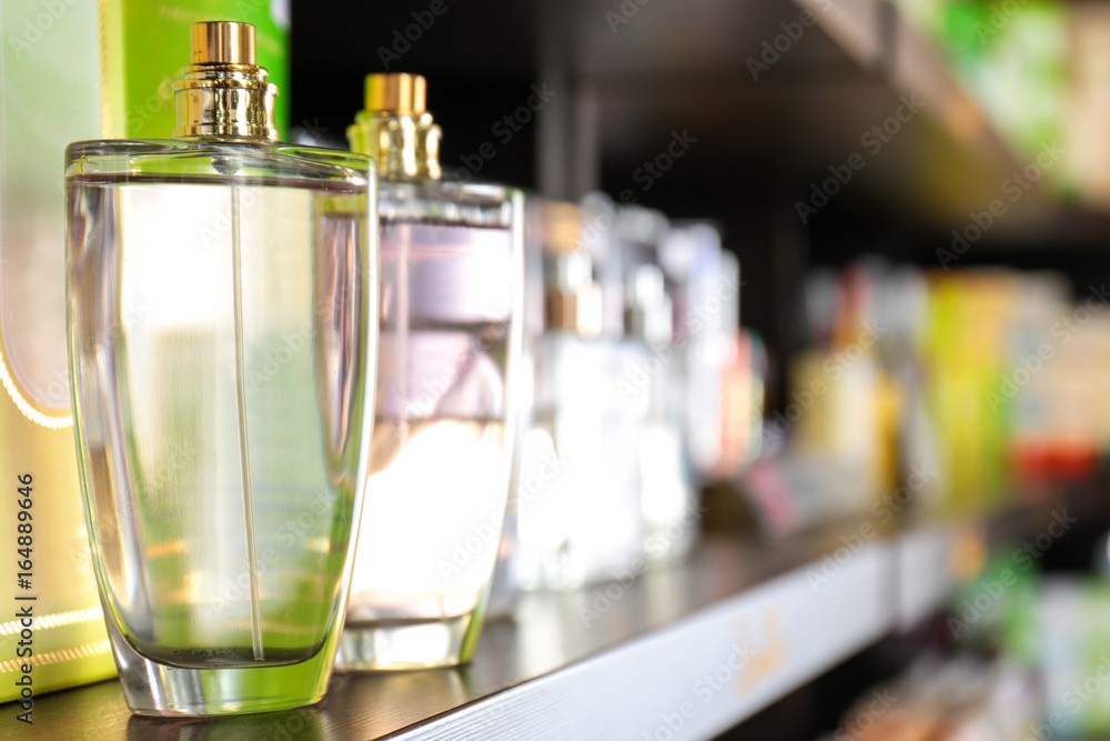 Shelving with different perfume in modern shop Shelving with different perfume in modern shop