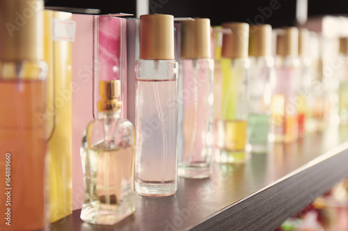 Shelving with different perfume in modern shop