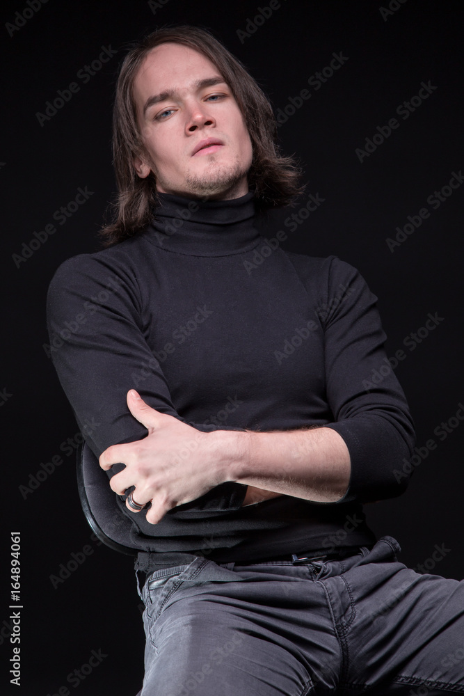 Daring brunette young man with arms crossed Daring brunette young man with arms crossed