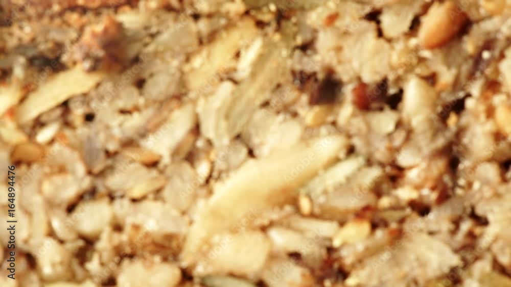 Nobody. Close up of homemade gluten free bread with seeds and nuts. Rack focus 4K ProRes HQ codec Nobody. Close up of homemade gluten free bread with seeds and nuts. Rack focus 4K ProRes HQ codec
