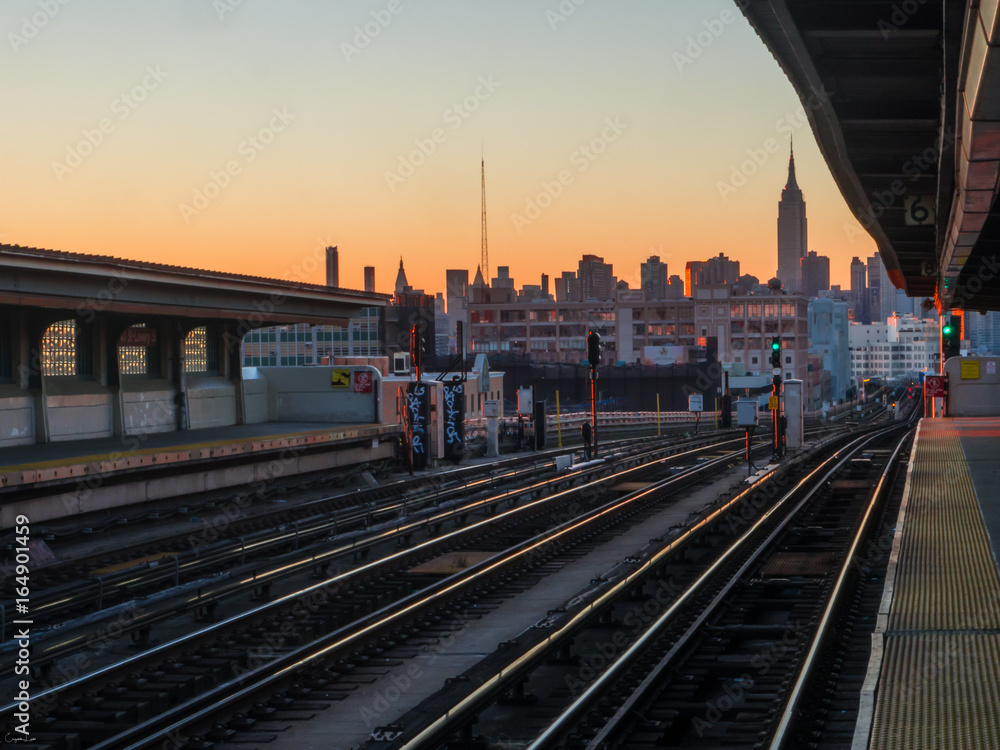 Train to NYC during sunset with the Empire State Building