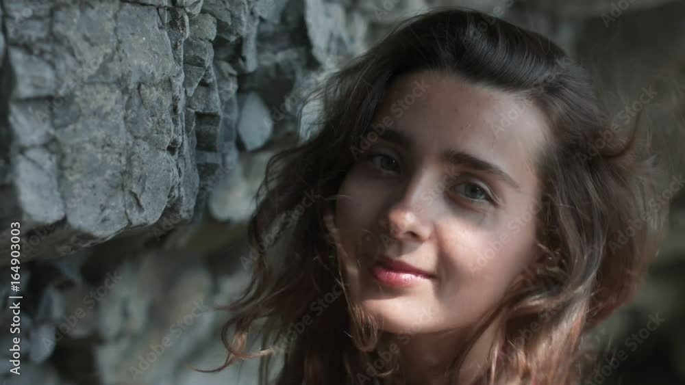 Sensual girl resting on the rocky beach Sensual girl resting on the rocky beach