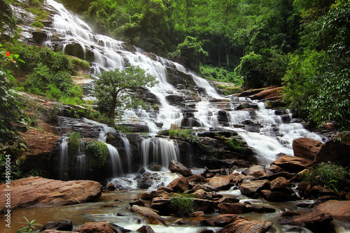 Beautiful natural of Mae Ya Waterfall at Chiang Mai province in Thailand , is a beautiful location and very popular for photographers and tourists. Traveling and recreation Concept.