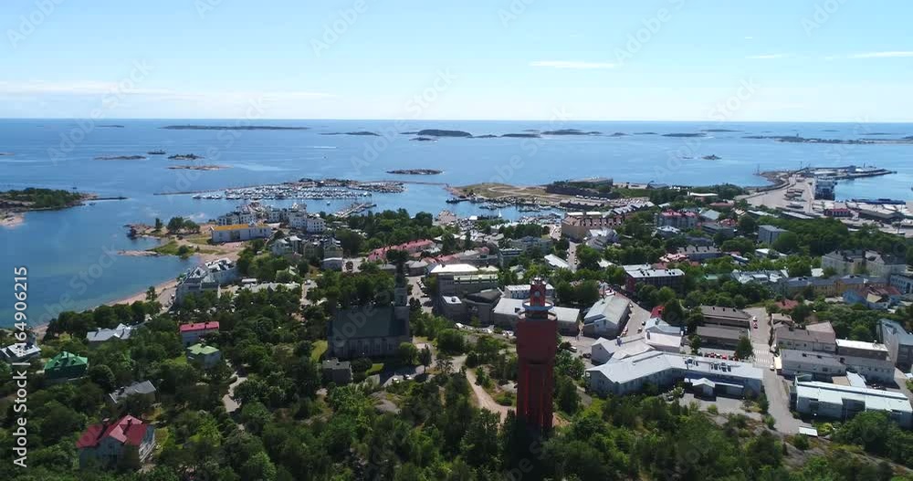 Hanko, Cinema 4k aerial view down to the water tower and the church, infront of the city, in Uusimaa, Finland Hanko, Cinema 4k aerial view down to the water tower and the church, infront of the city, in Uusimaa, Finland