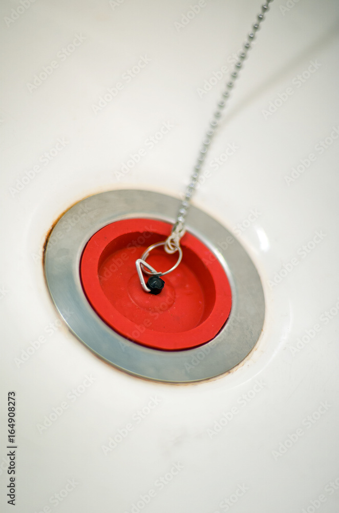 Red rubber bath plug on chain Red rubber bath plug on chain