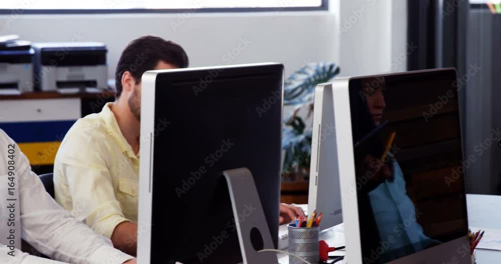 Business executives working at desk Business executives working at desk