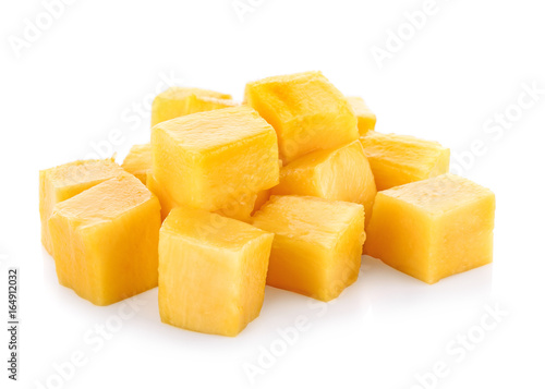 Mango slice cut to cubes isolated on white background.