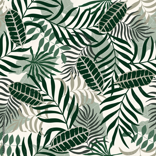 Tropical background with palm leaves. Seamless floral pattern