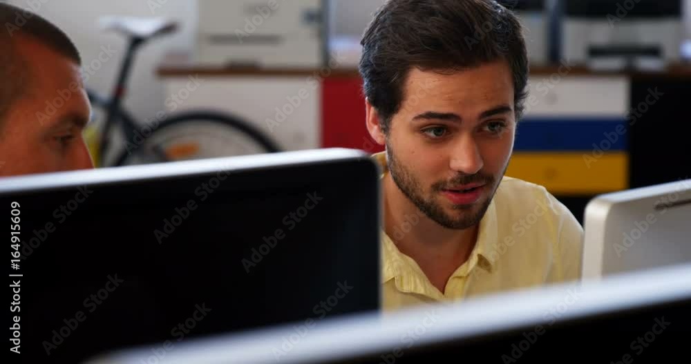Business executives working over computer Business executives working over computer