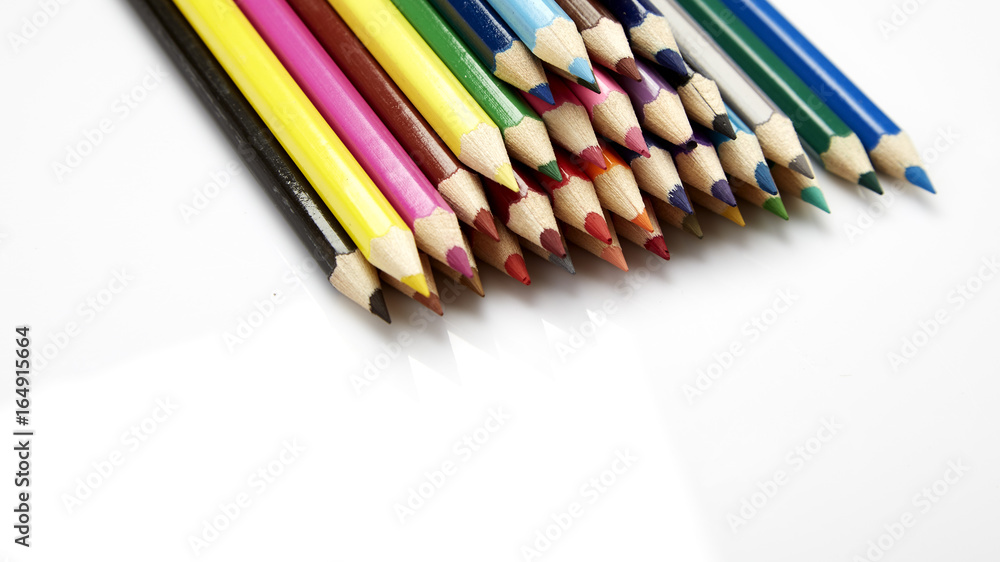 Fototapeta premium Many different colored pencils on white background