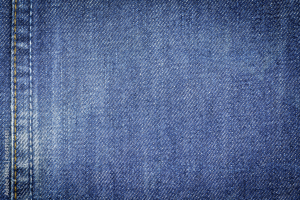 Naklejka premium Denim jeans fabric texture background with seam for beauty, fashion and clothing idea concept design.