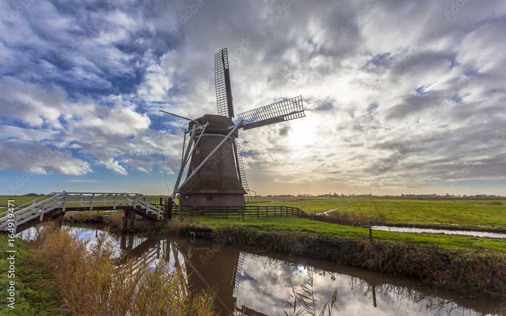 Dutch windmill in frisian polder