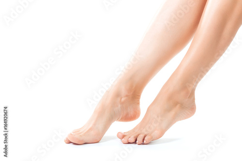 Beautiful women feet isolated on white close-up © fotofabrika