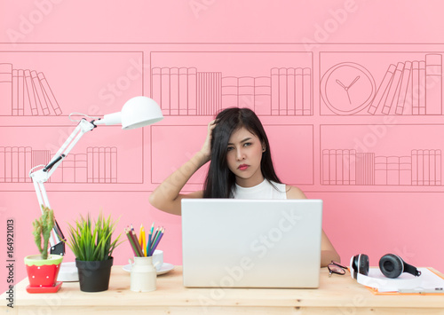 young beautiful working at computer desk feeling tired and bored looking overworked