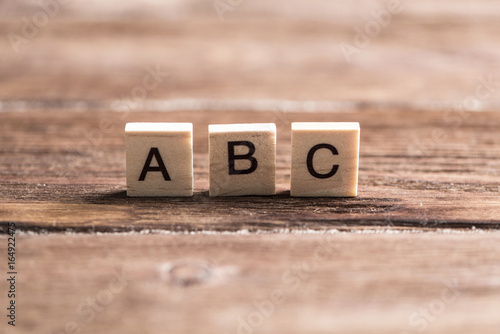 wooden elements with the letters collected in the word abc photo