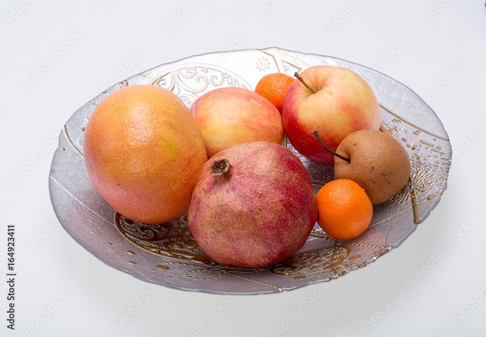 mix fresh fruits on plate isolated on white mix fresh fruits on plate isolated on white