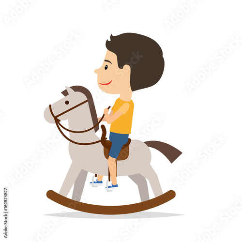 Little boy sitting on horse toy