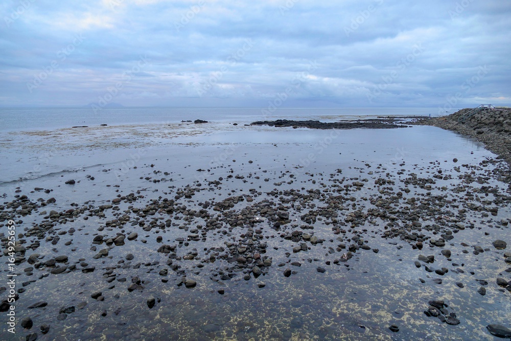 stony shore on gardur in iceland