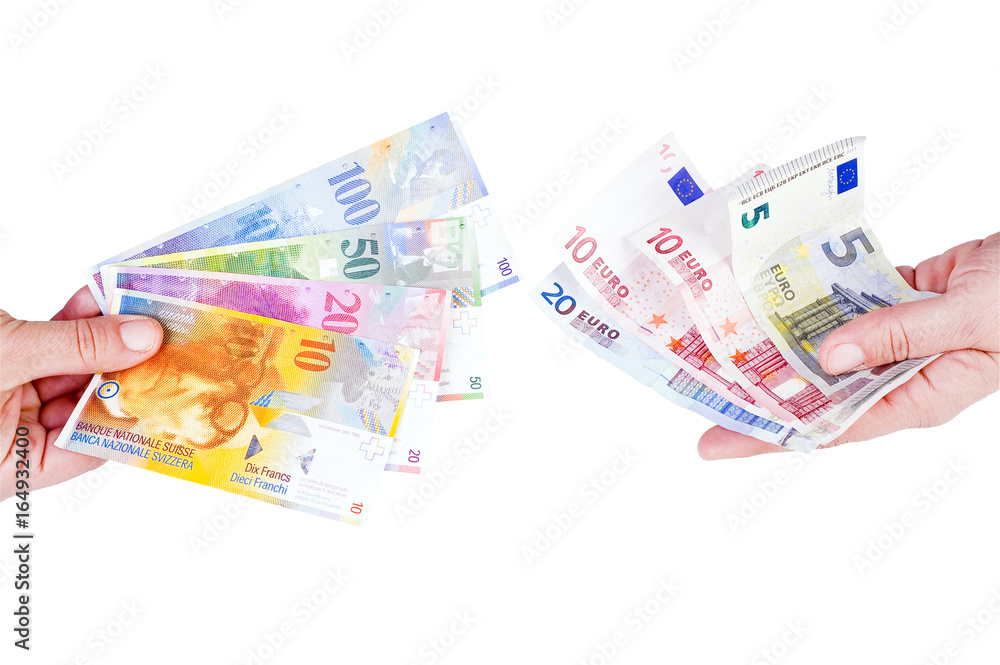 euro and Swiss franc in the hands of euro and Swiss franc in the hands of