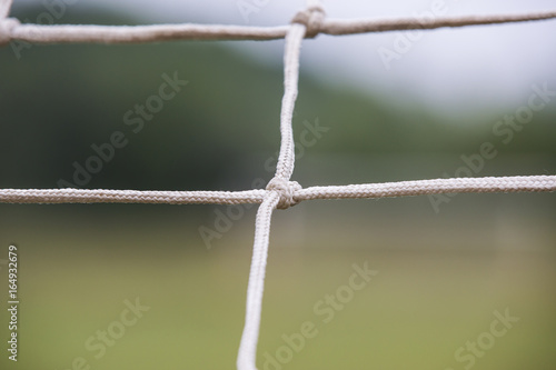 Soccer goal net during the game background in blur