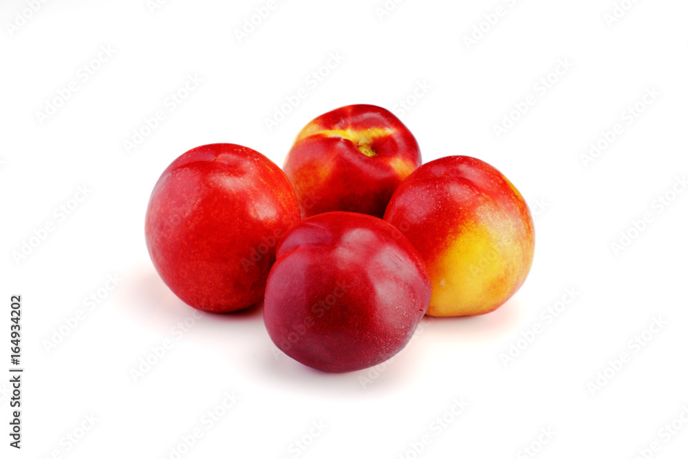 Group of whole nectarine fruits isolated on white background Group of whole nectarine fruits isolated on white background