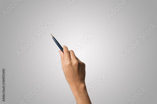 Woman hand with pens isolated on white background.