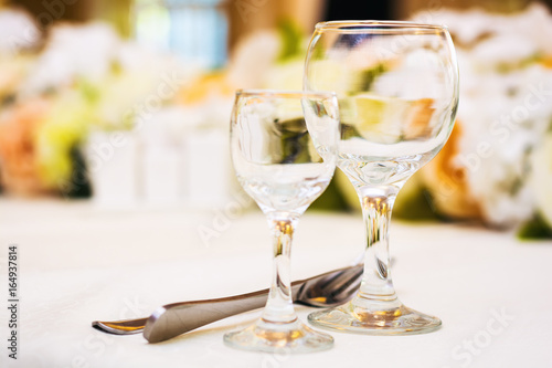 Empty wine glasses in restaurant photo