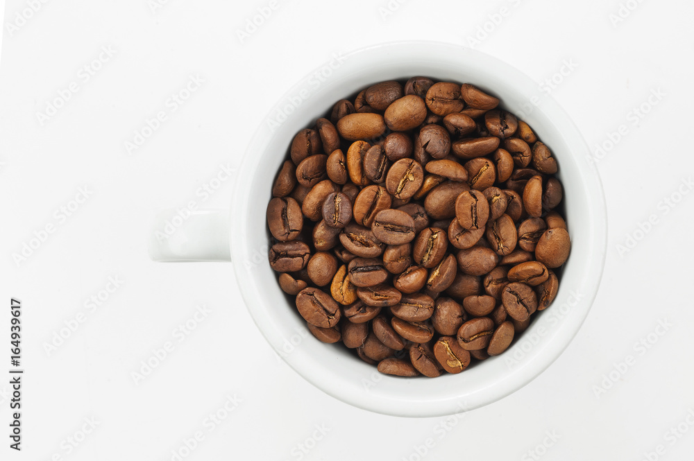 coffee beans in a white cup coffee beans in a white cup