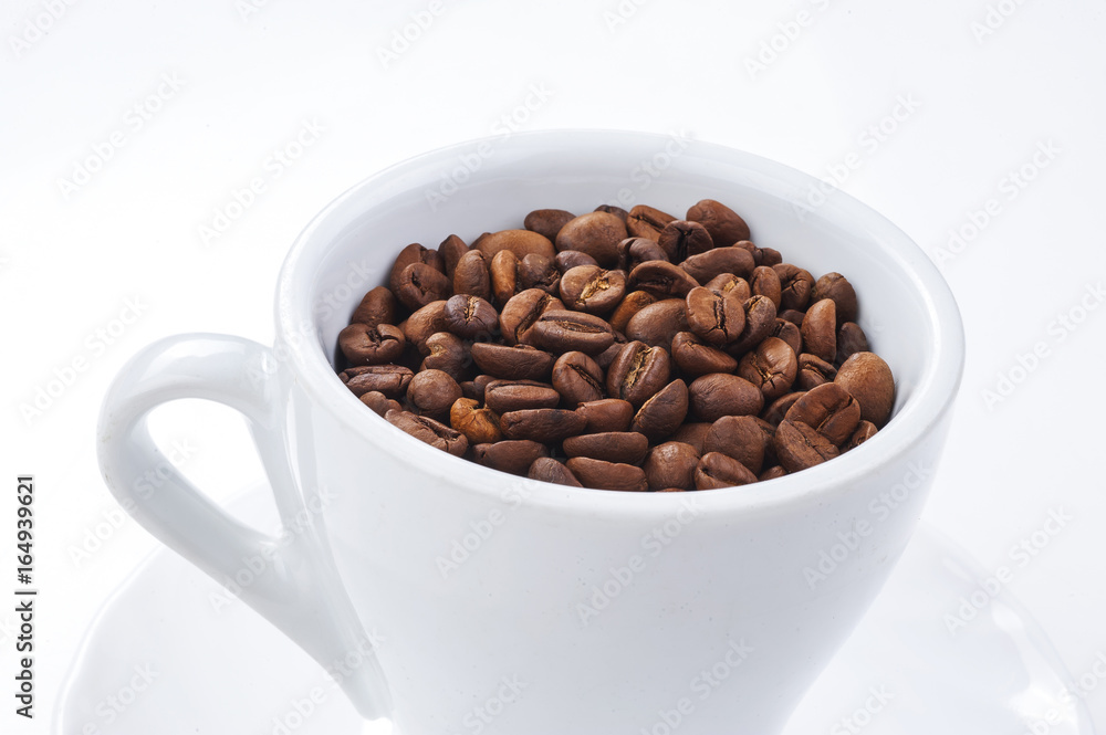 coffee beans in a white cup