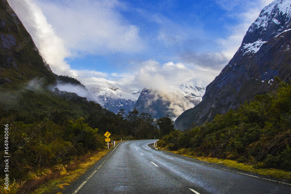 Naklejka premium perspective photography of road to milford sound national park most popular natural traveling destination in southland new zealand