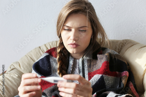 Young ill woman with electr...
