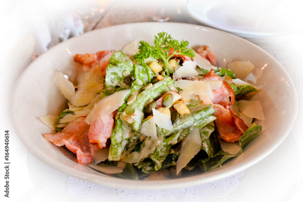 Caesar Salad, Italian traditional salad. Fresh vegetable, crispy bacon and ceasar salad dressing. Good for everyone health. Caesar Salad, Italian traditional salad. Fresh vegetable, crispy bacon and ceasar salad dressing. Good for everyone health.