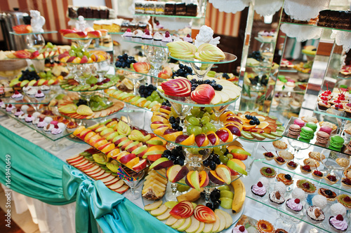Fantastic wedding banquet table with awesome decor and delicious dishes.