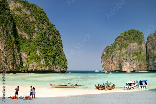 Bild auf Leinwand Tourists and longtail boats at Maya Bay on Phi Phi Leh Island, Krabi Province, T