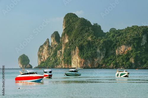 Motorboats anchored at Ao Loh Dalum beach on Phi Phi Don Island, Krabi Province, Thailand photo