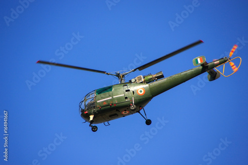 Fototapeta Naklejka Na Ścianę i Meble -  Military helicopter in blue sky, Jaipur, Rajasthan, India