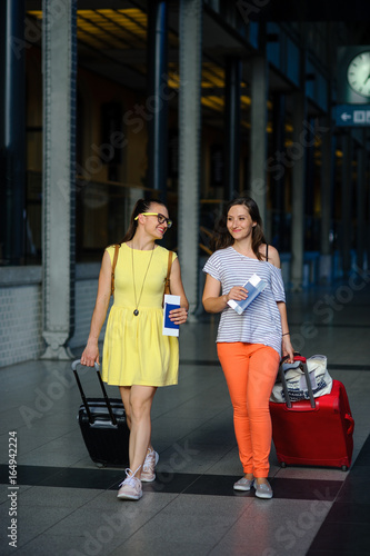 Young women hurry to their train