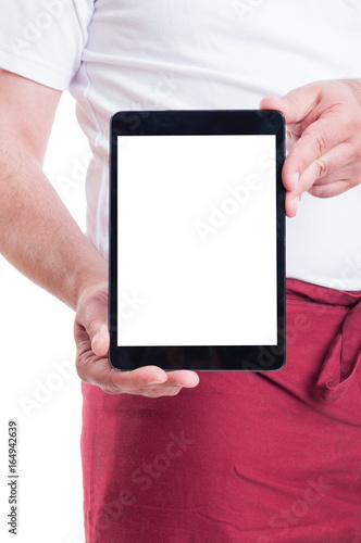 Supermarket seller showing tablet pc with blank display photo