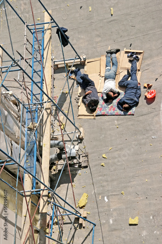 Sleeping migrant workers at the construction site