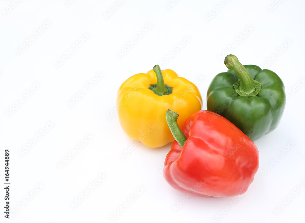 Green, red and yellow bell pepper isolated on white background. Green, red and yellow bell pepper isolated on white background.