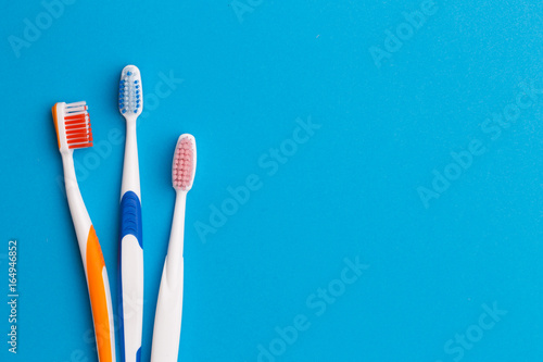 Colorful toothbrushes   space for text